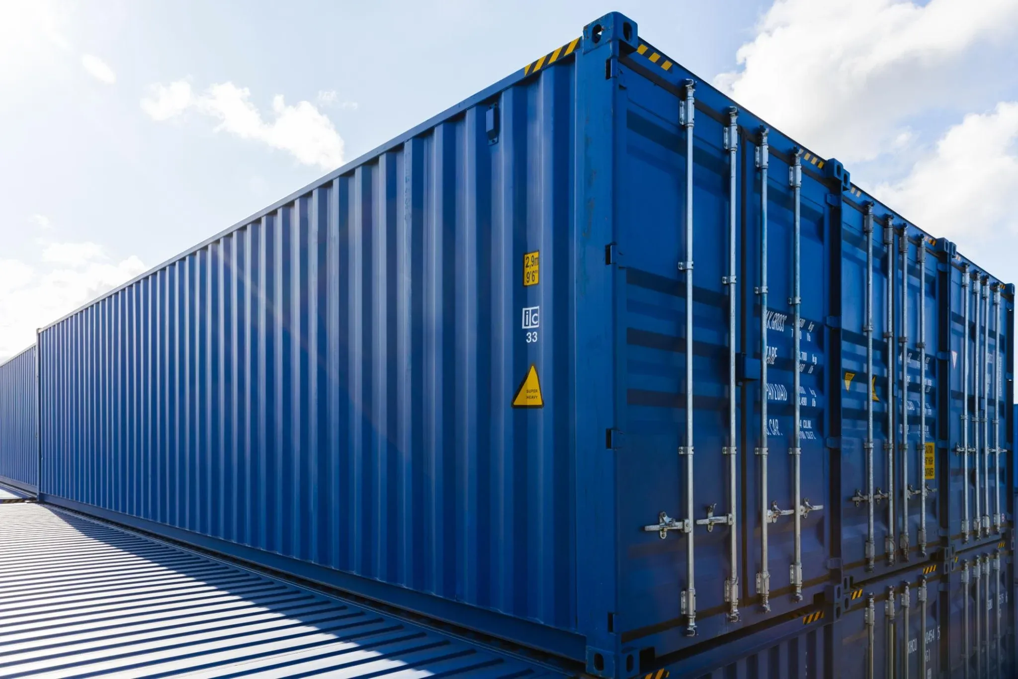 Blue shipping container photographed outdoors
